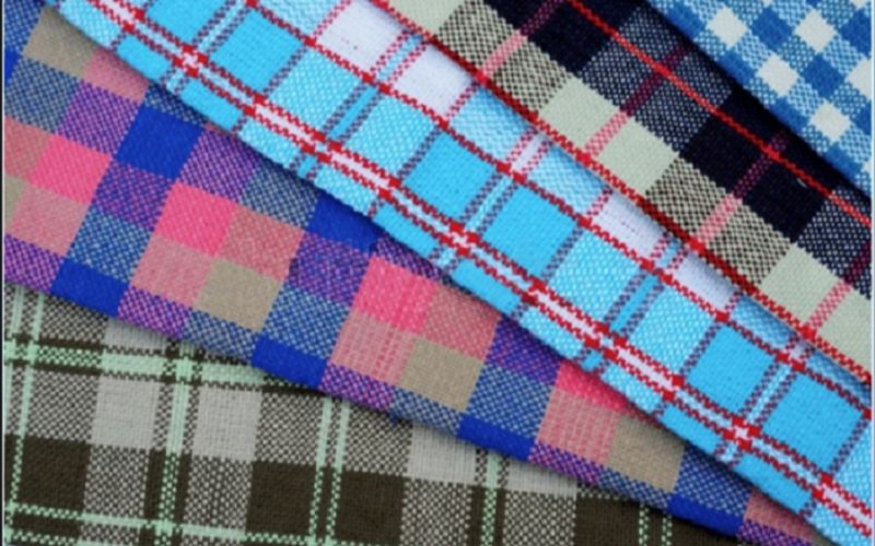 Variety of kilts in different tartan patterns and colors, showcasing traditional and modern designs